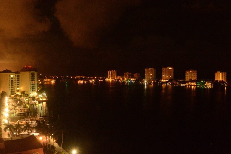 Boca Bay waterfront homes and boats at dusk in Boca Raton