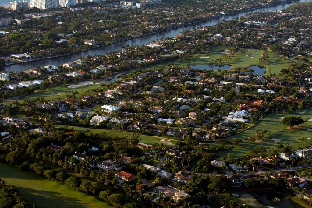 Aerial view of Royal Palm Yacht Club in Boca Raton, golf course, waterway and waterfront estates